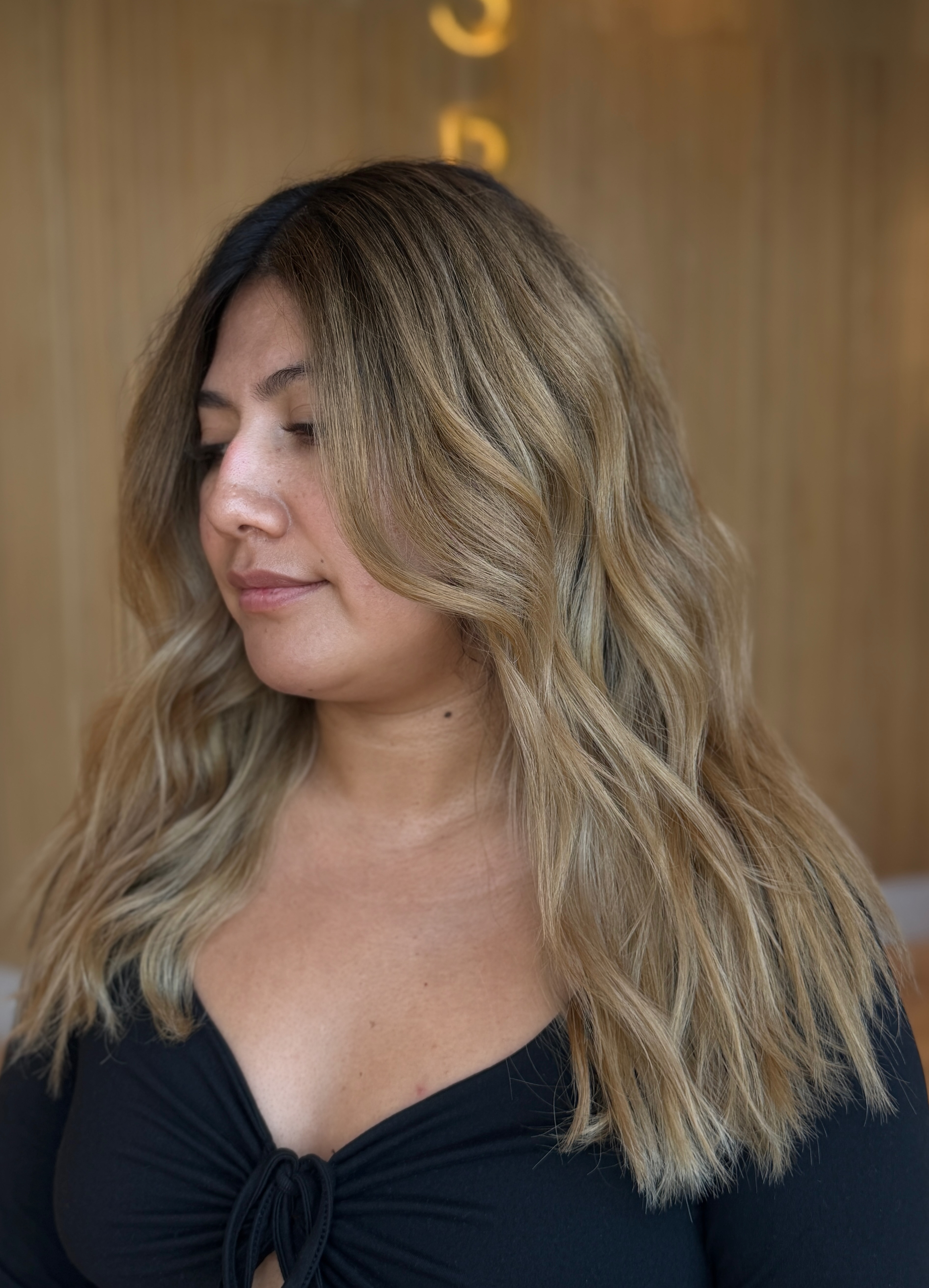 Dark-root to golden-blonde shadow root melt, textured beachy waves on medium-length hair — blonde specialist near Upland & San Bernardino, Likha Studio